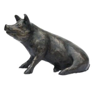 Bronze pig sculpture Susie sitting in a relaxed pose with detailed snout floppy ears and textured surface