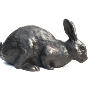 Bronze wild rabbit sculpture in crouched position with detailed textured finish